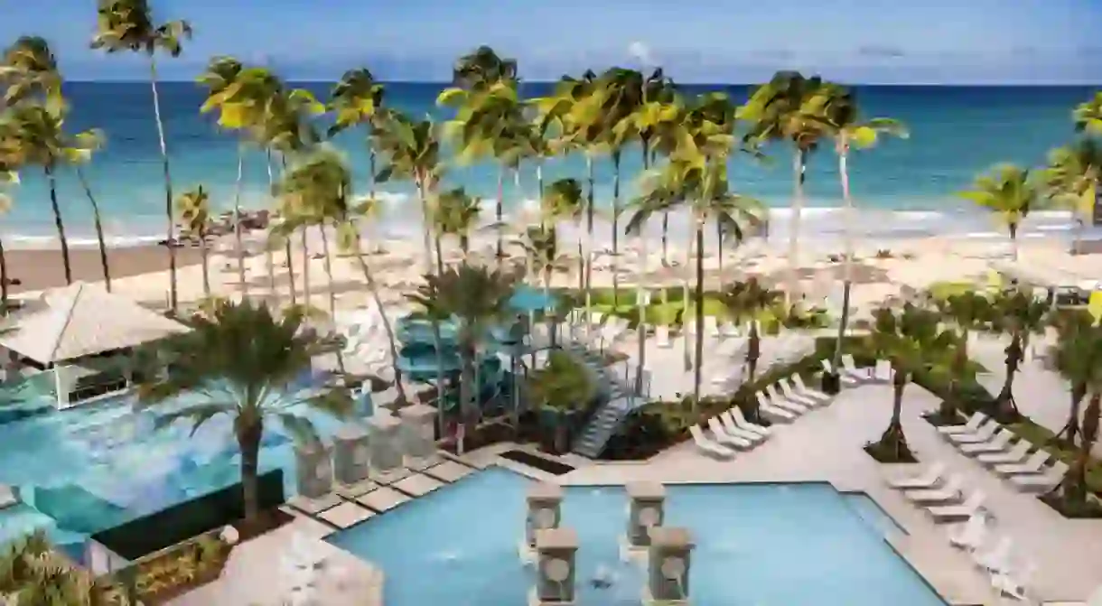 Grab a lounger at the San Juan Marriott Resort for a chilled afternoon dipping in the pool or ocean