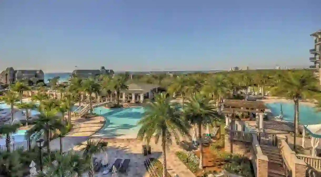 Pools lined with palm trees beckon at the Henderson Lofts in Destin, Florida