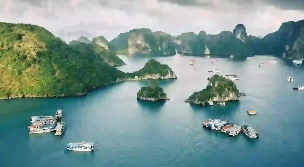 Explore the beautiful islands in Ha Long Bay, Vietnam, via a boat cruise