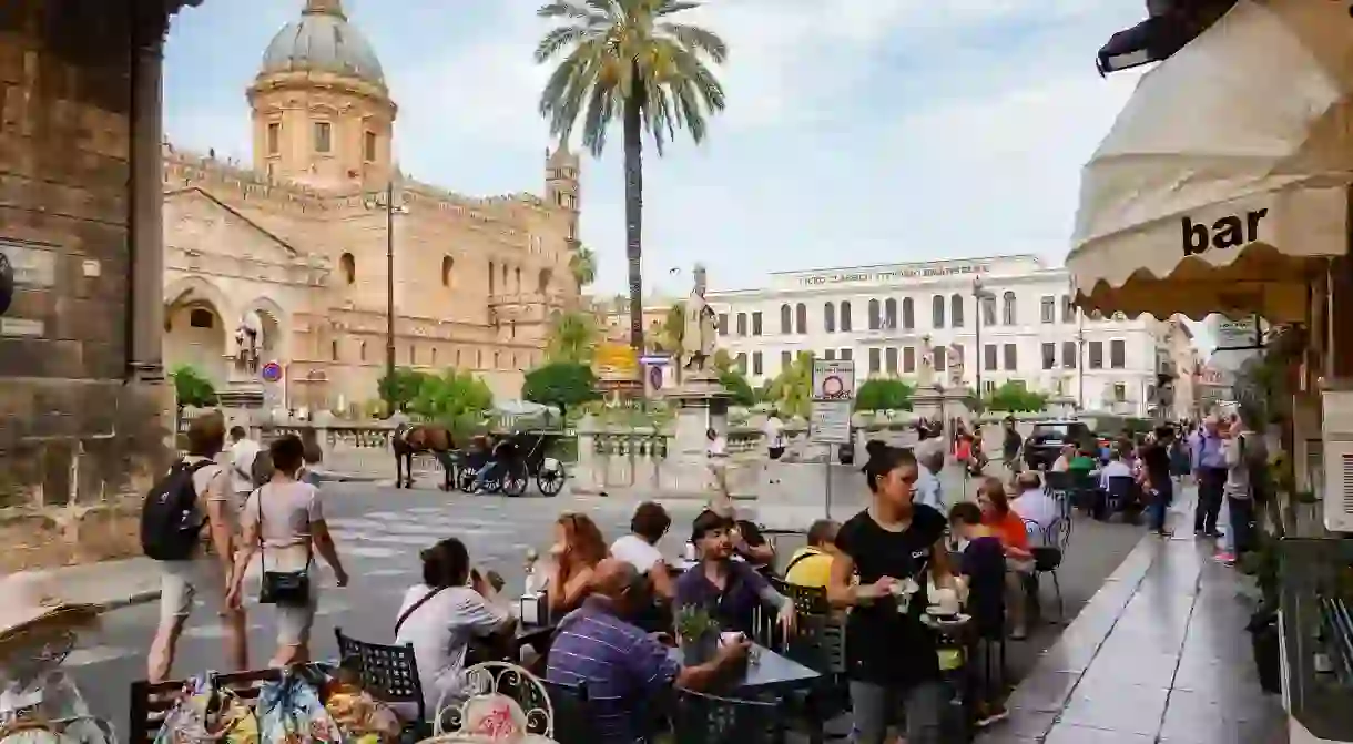 The cafes near the Cathedral of Palermo, Sicily, are an ideal place for people-watching