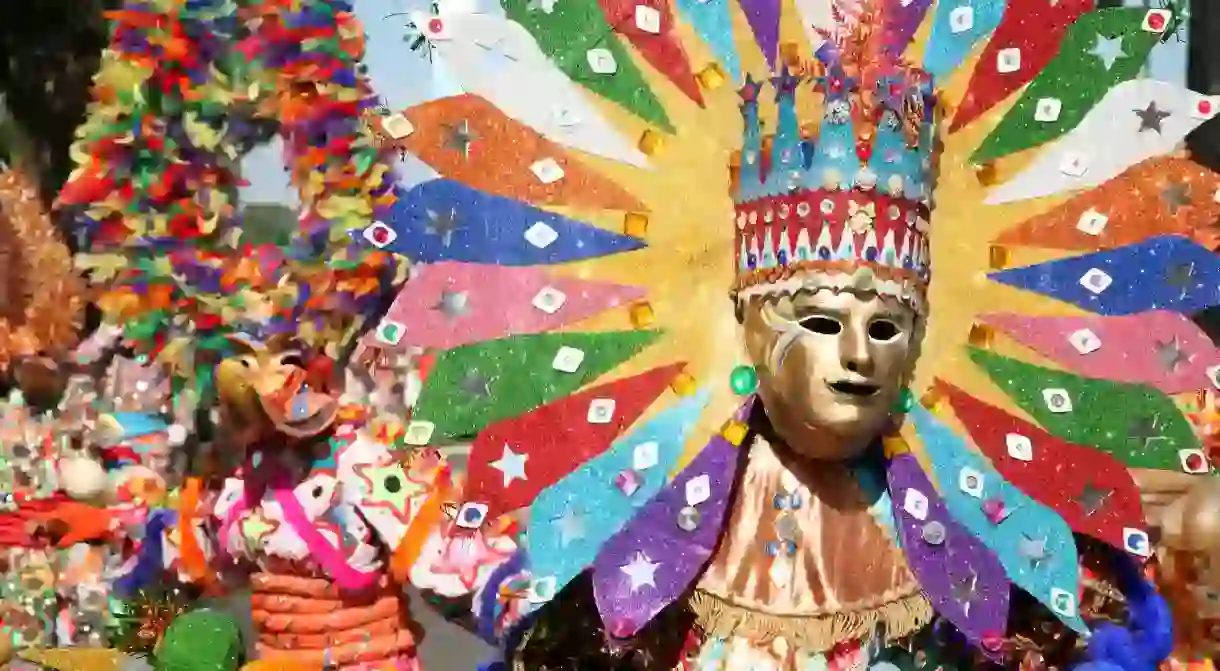 Carnival participants from Santiago dressed up as Diablo Cojuelo performing during Santo Domingo Carnival, Dominican Republic