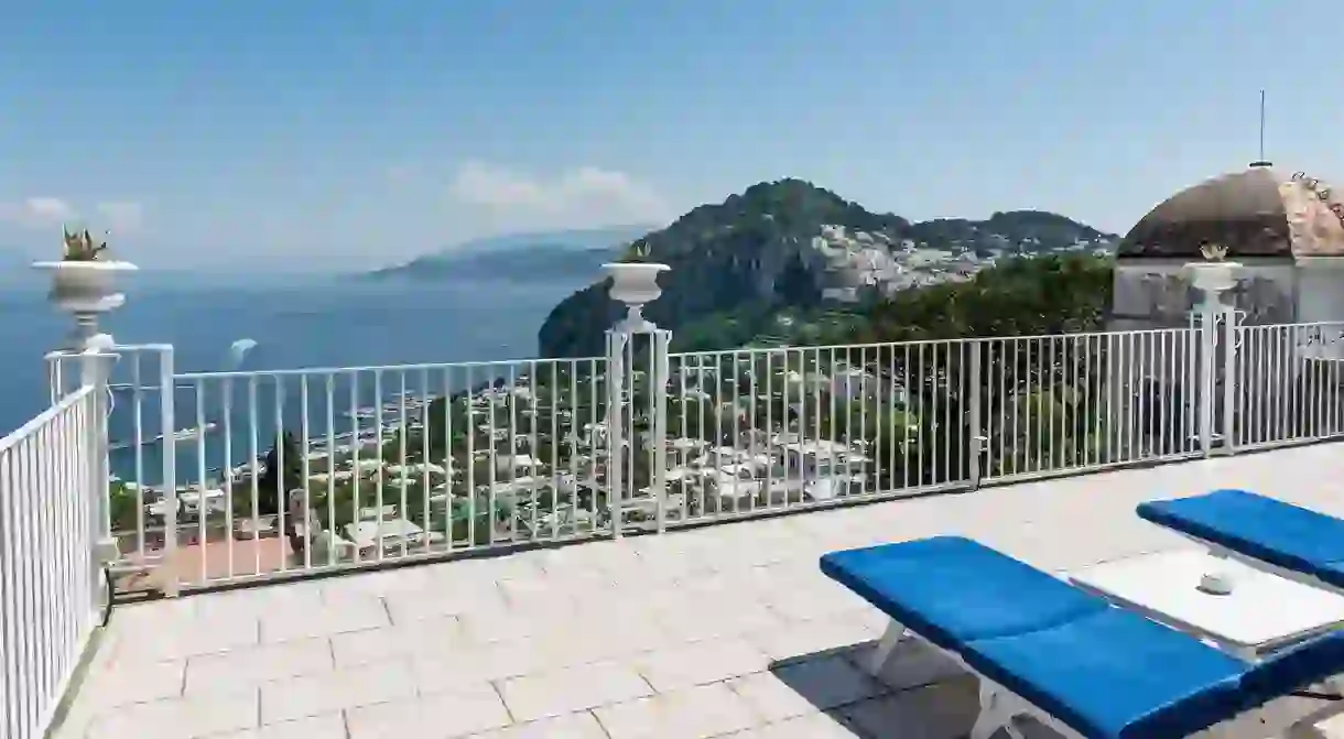 From the terrace at Villa Quattro Venti on Capri, you get to take in views of verdant cliffs and the Mediterranean Sea