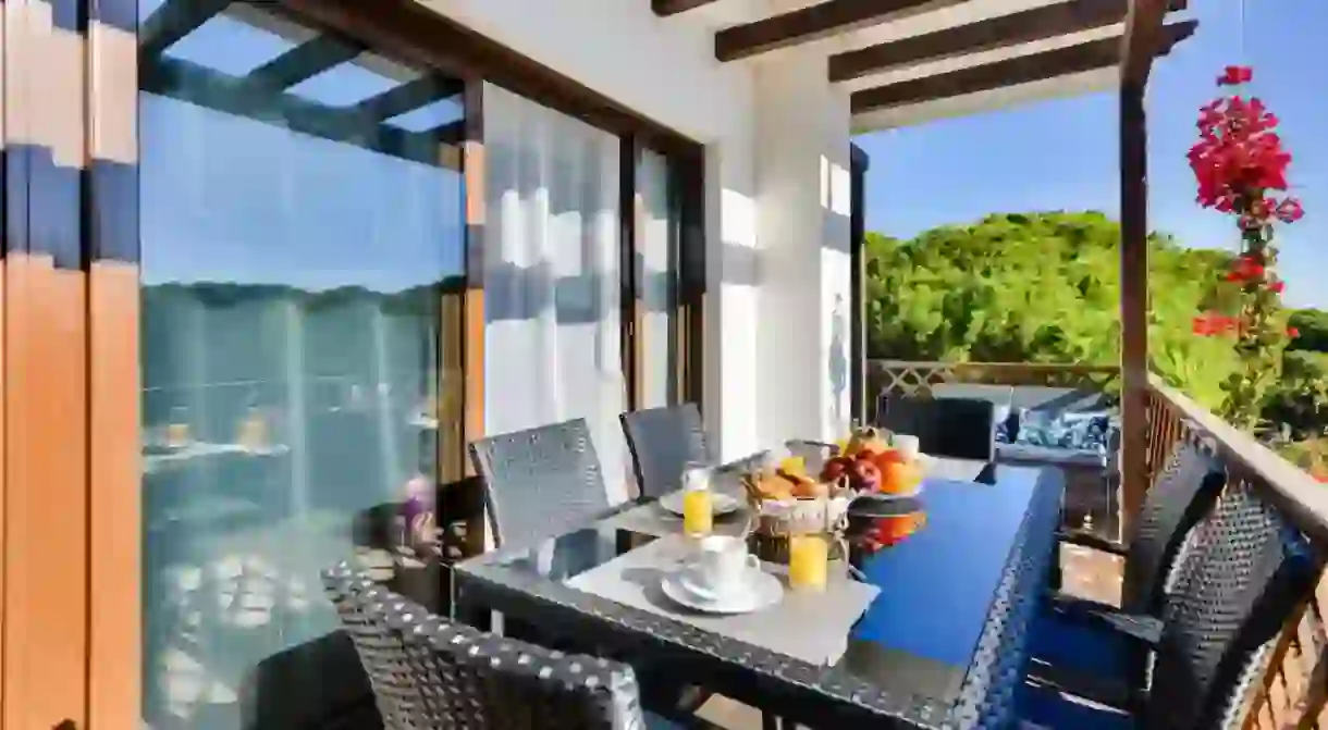 Enjoy your meals on your private balcony at Falesia Beach B