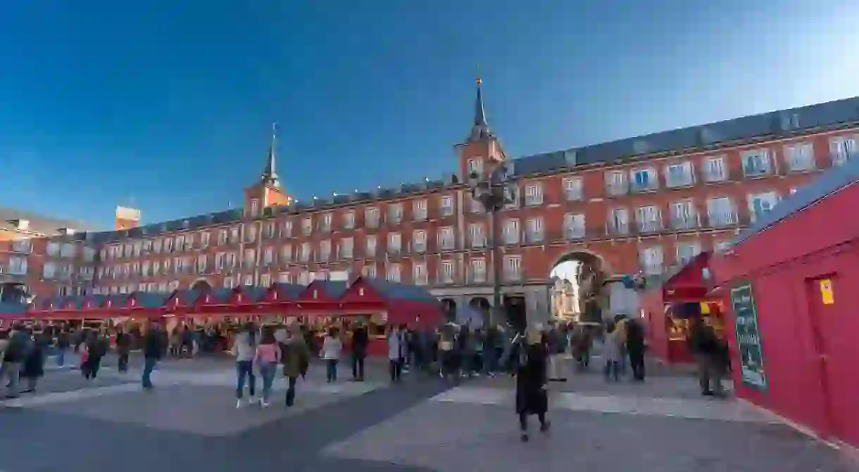 A traditional Christmas market at Plaza Mayor, the iconic central square of downtown Madrid