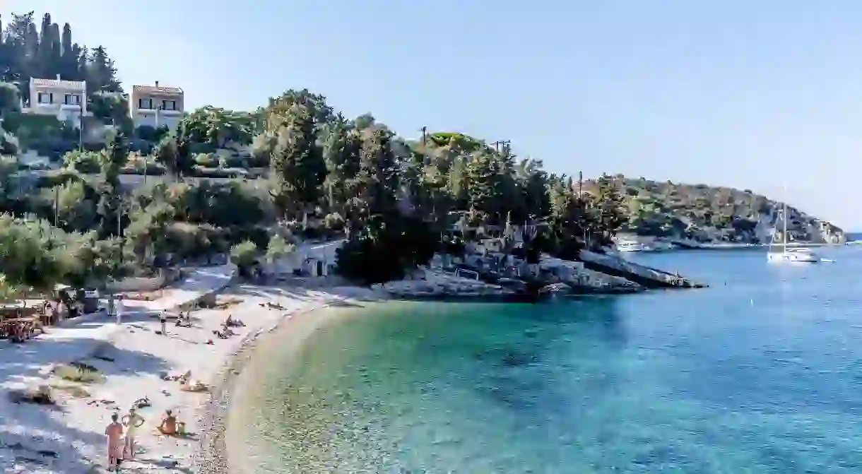 Marmari Beach is in a delightful sheltered bay shaded by olive trees