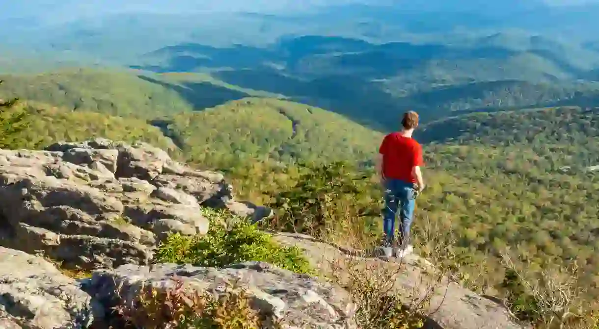 Take a trip to Grandfather Mountain State Park to hike up endless mountains and bear witness to its iconic peak