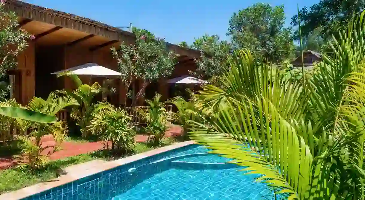 Relax by the palm-fringed pool at the Sok Sabay Resort in Sihanoukville