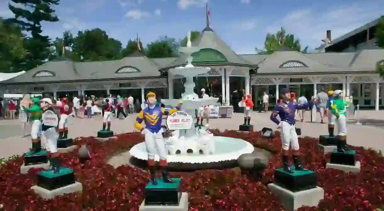 The jockey statues outside the Saratoga Race Course immerse you in racing history before you even enter