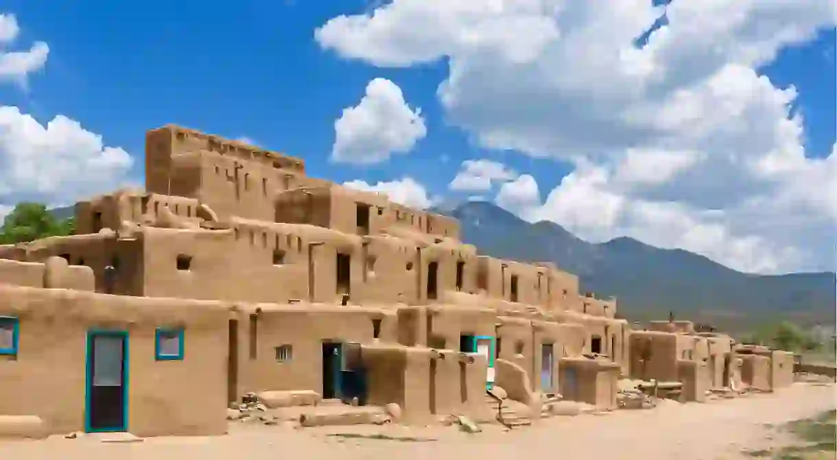 Visit Native American dwellings in historic Taos Pueblo, New Mexico