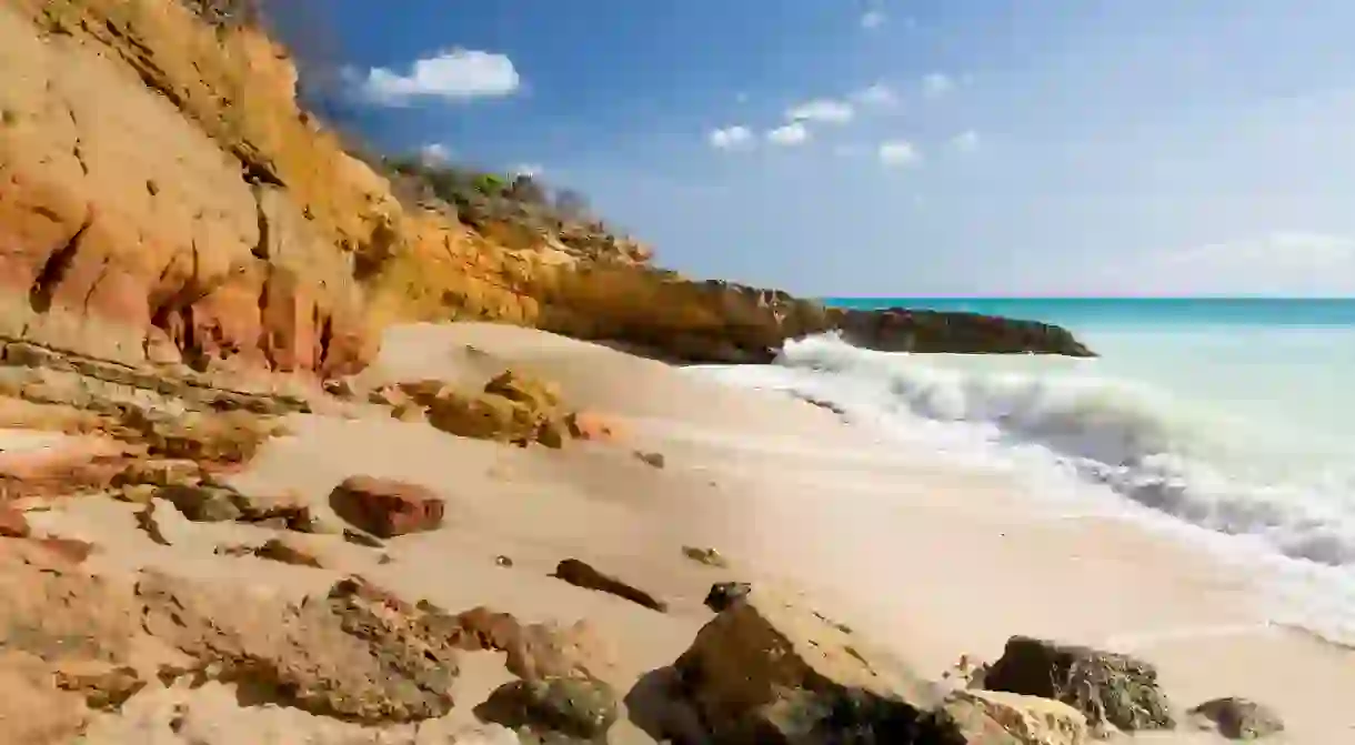 Sandstone cliffs frame Cupecoy Beach on Sint Maarten St Martin Caribbean