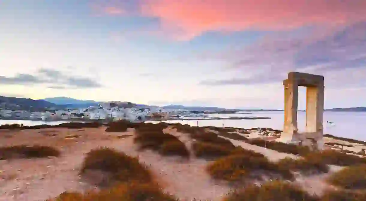 Catch the spectacular sunset views from the Temple of Apollo over the old town on Naxos island