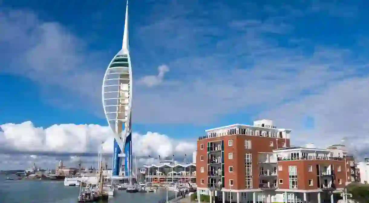 The Spinnaker Tower pierces the clouds over Gunwharf Quays in Portsmouth