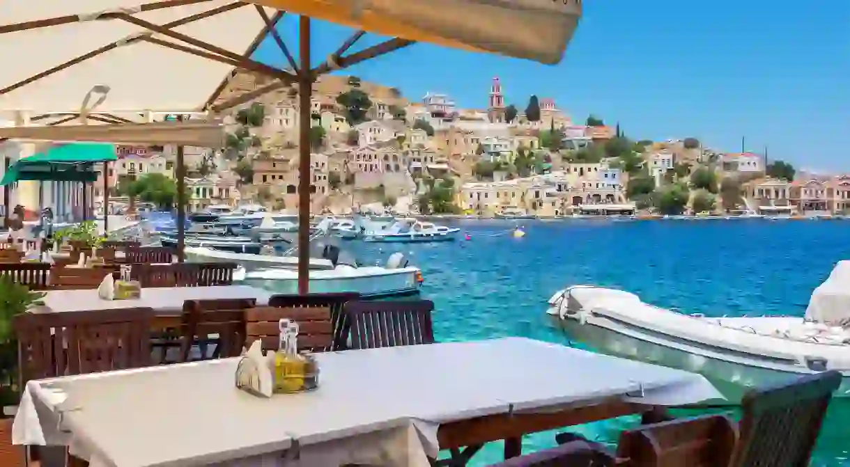 Have your meals with harbour views in Symi town