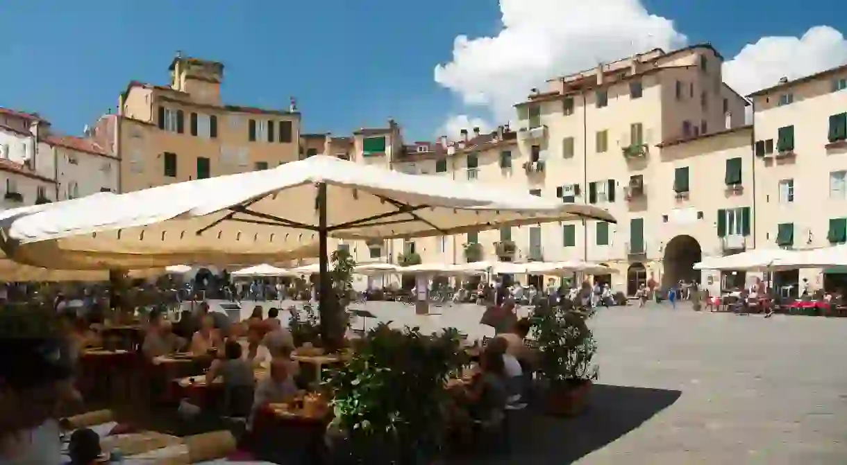 Piazza dellAnfiteatro sits at the heart of aperitivo culture in Lucca