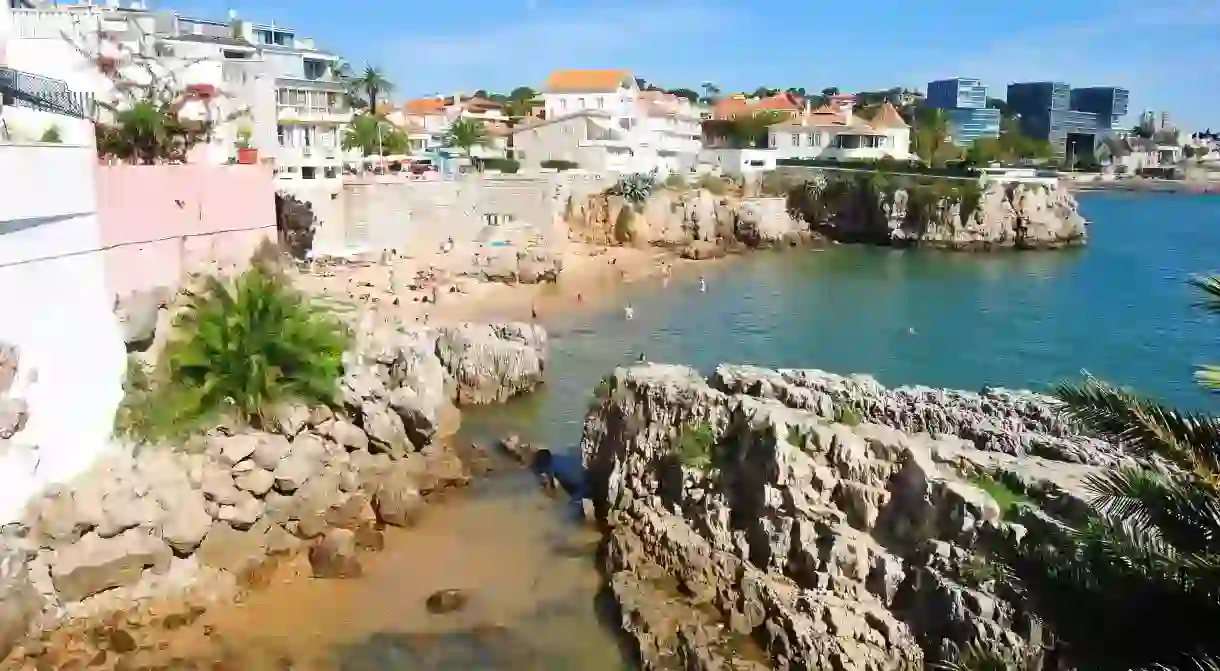 Visitors and locals flock to Cascais beaches to cool off from the summer heat