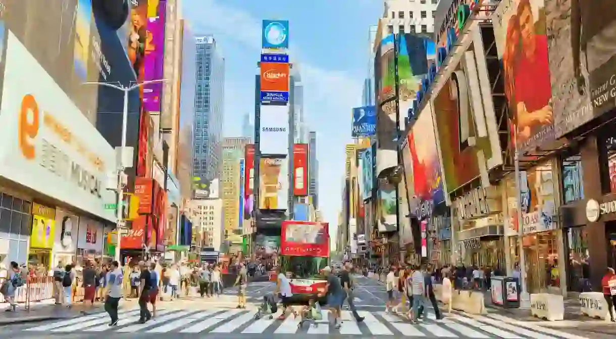 Spend the morning strolling through central Times Square before catching a Broadway show in New Yorks Theater District