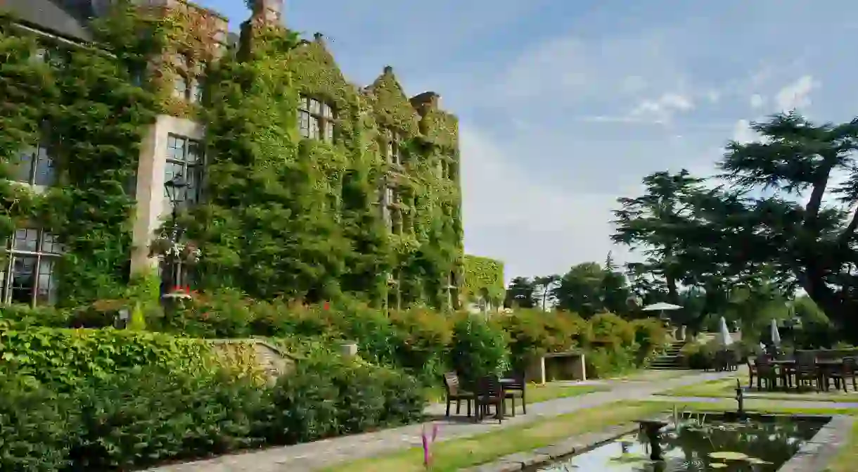 The façade of the Pennyhill Park Hotel and Spa in Bagshot is covered in ivy