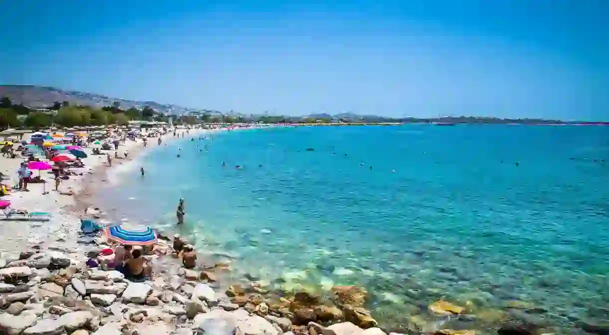 Pebbly Glyfada Beach is just a short tram ride away from Athens