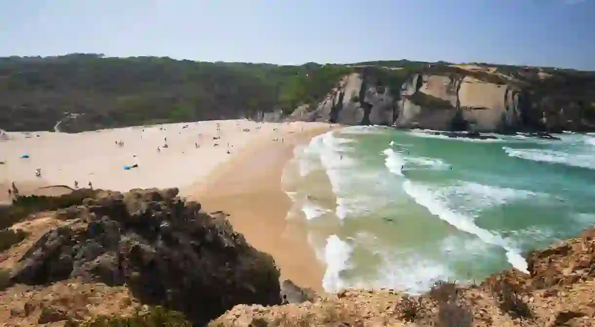 Escape the tourist-filled beaches and head to the tranquil Praia do Carvalha