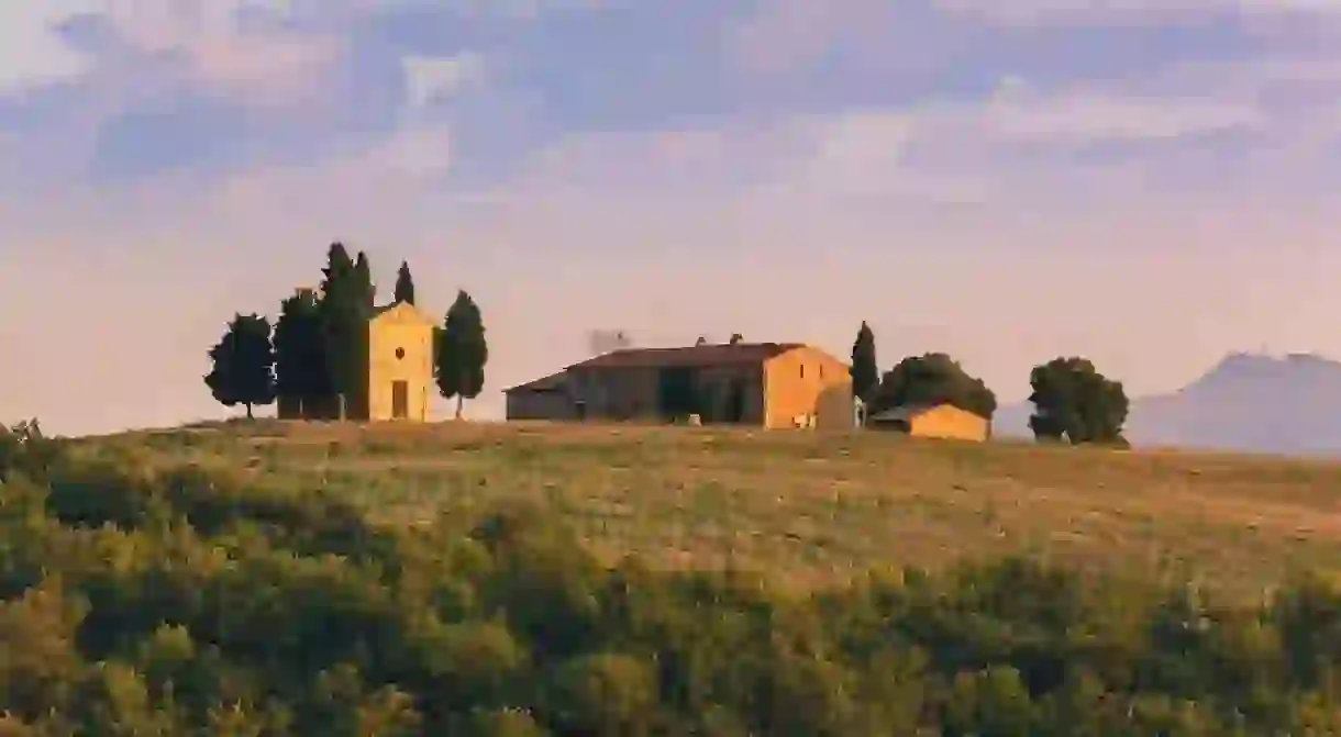 A tiny white-stone chapel surrounded by cypress trees, the Chapel of the Madonna di Vitaleta makes an excellent photo opportunity