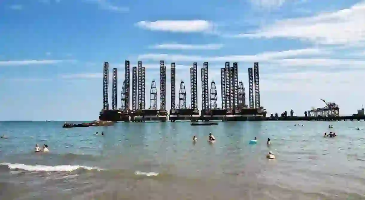 There is an oil rig by Caspian Beach, Azerbaijan