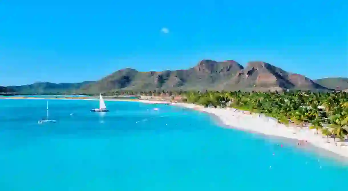 Make for the paradisiacal shoreline in Antigua to explore beautiful beachside towns