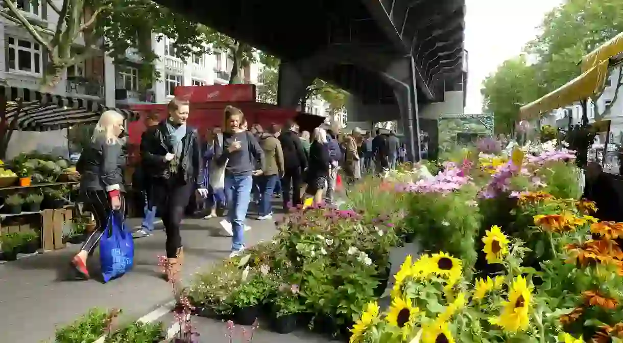 Isemarkt, Market in Hamburg. The longest weekly market in Germany is protected from rainfall under the subway bridge. I was able to find all kinds of food, groceries and other fruit products