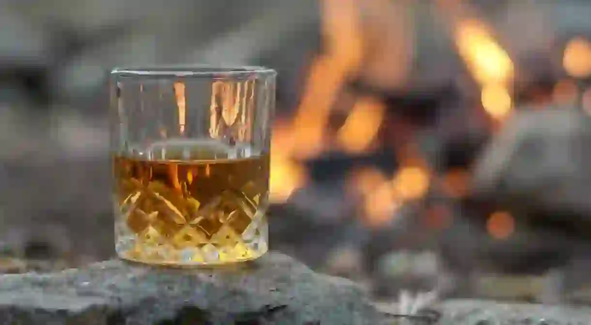 Vintage crystal glass of bourbon whiskey