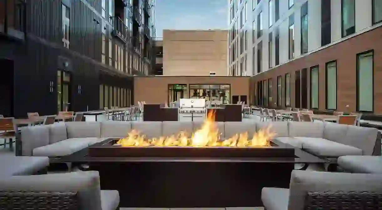 Pull up a seat by the firepit at the Element hotel to relax and socialize with other guests