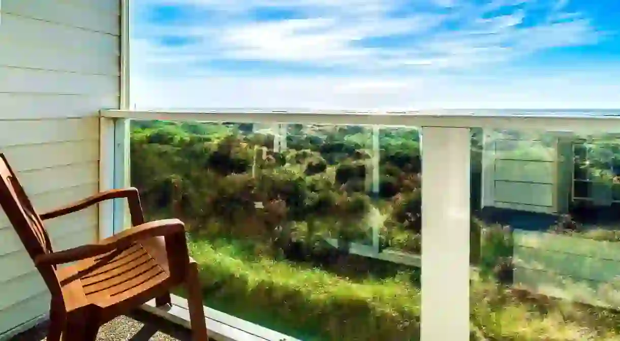 Gaze out over greenery and onto the ocean from your balcony at Ocean Paradise Hotel and Resort