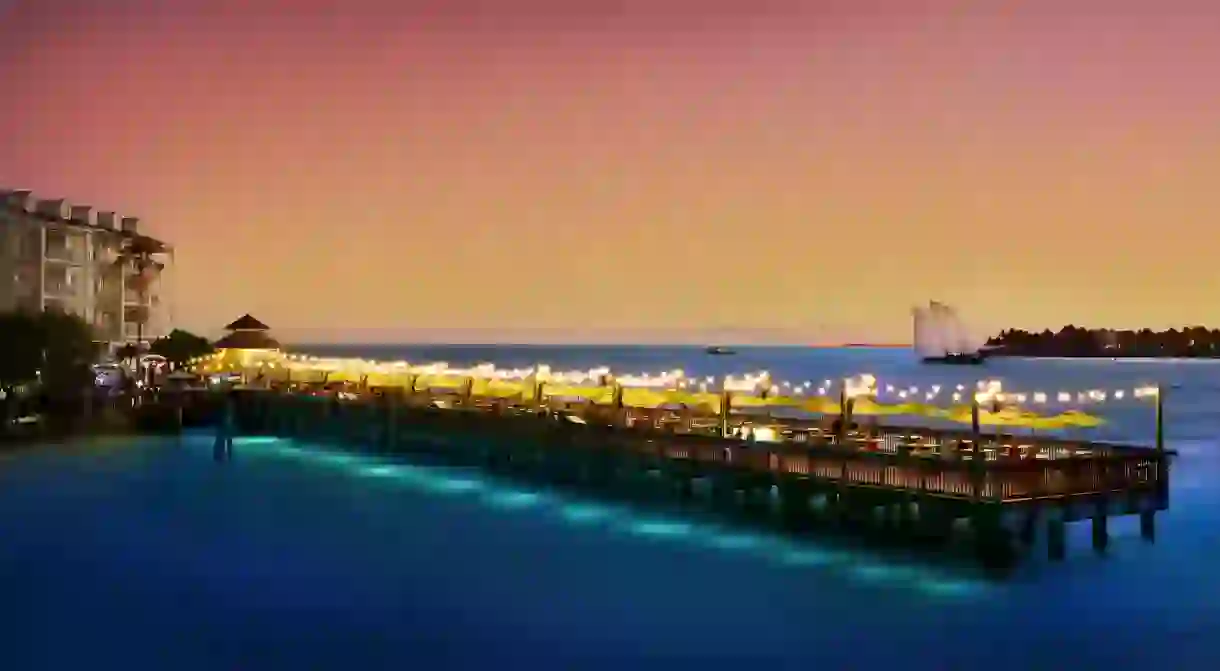 Enjoy a romantic dinner at night on the pier at the Ocean Key Resort