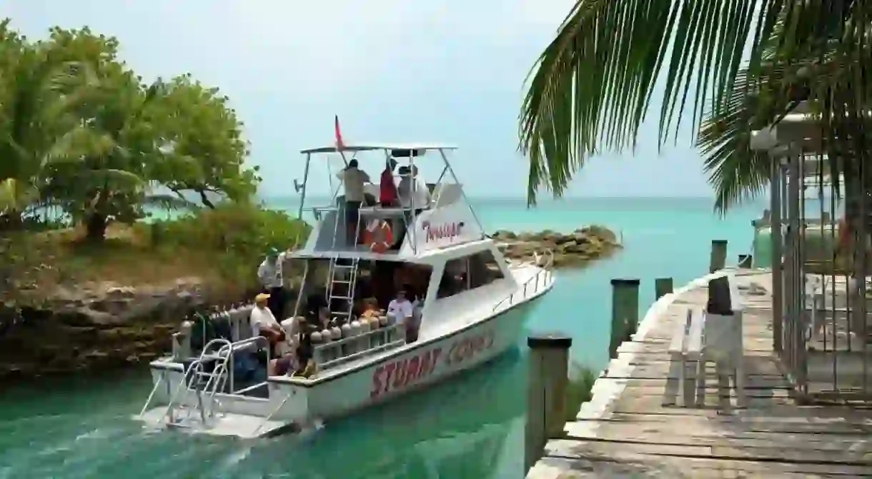 Dive boat leaving Stuart Cove s Aqua Adventures centre New Providence Island Bahamas