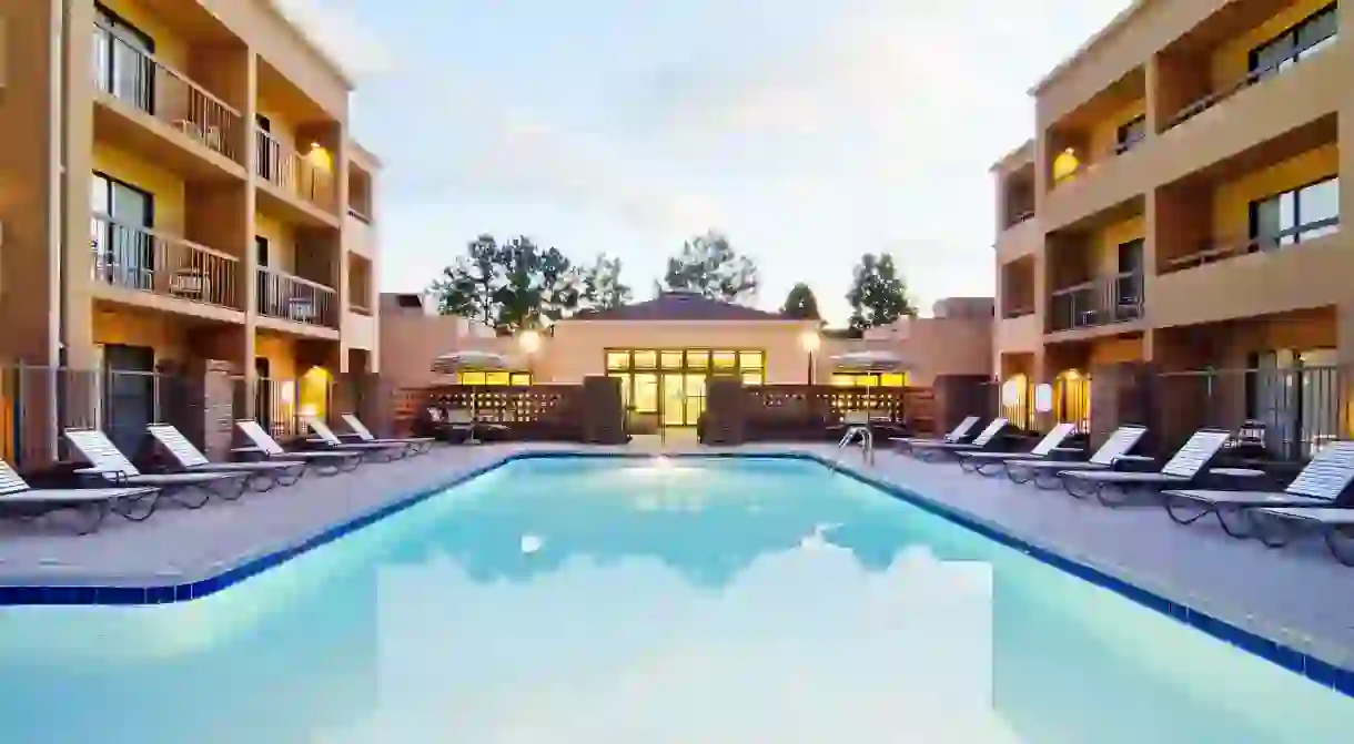 The outdoor pool at Courtyard by Marriott Huntsville is ideal for secluded relaxation