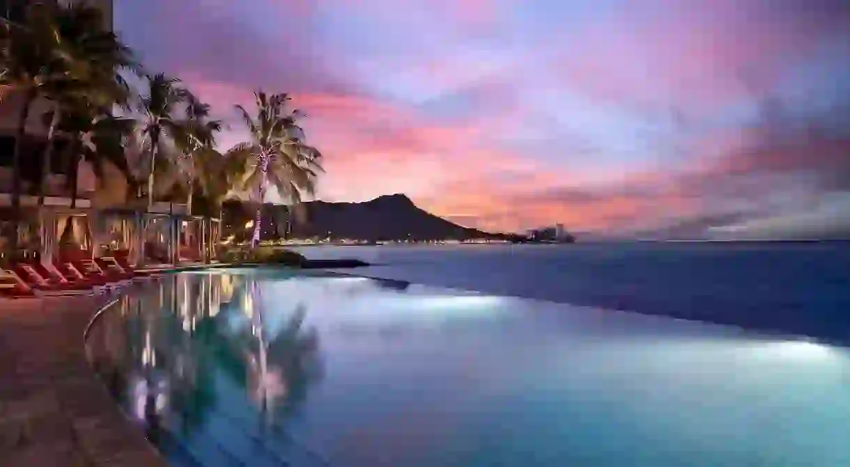 See the spectacular sunsets from your hotels infinity pool on a luxurious getaway to Waikiki Beach