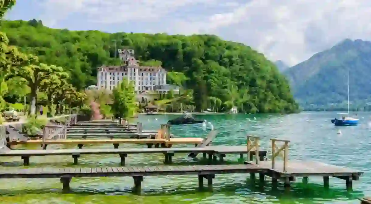 Palace de Menthon features on many itineraries for boating on Lake Annecy