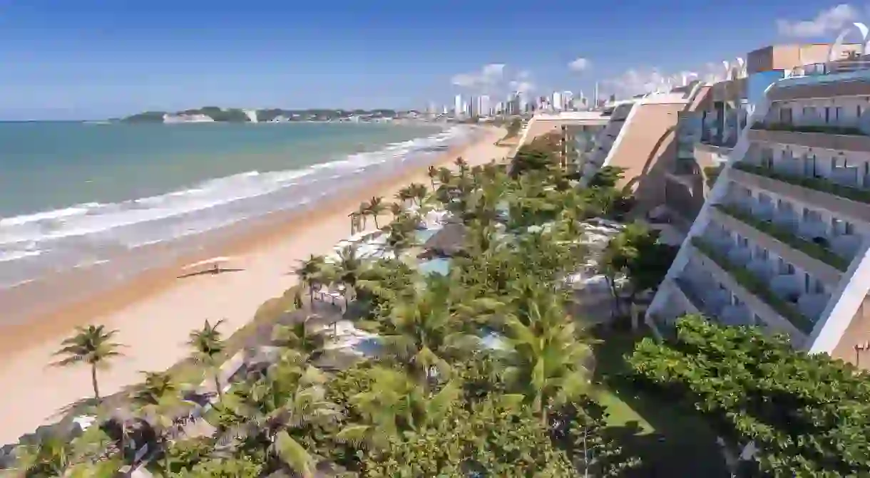 Palm-lined white-sand beaches await you in Natal, Brazil