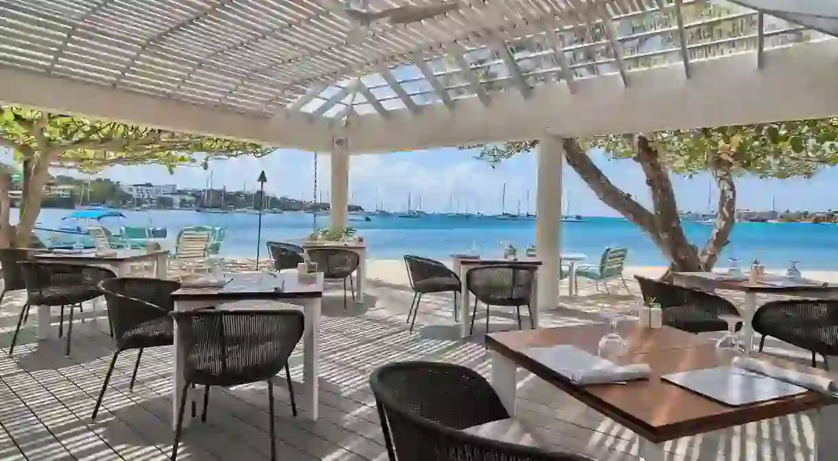 Sail into the Beach Club at Calabash and soak up the views as you dine