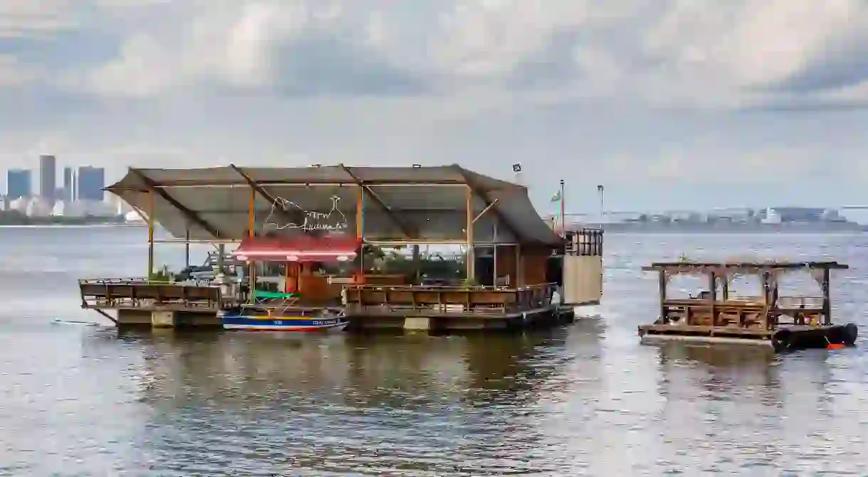 View from Urca district of its offshore floating restaurant/bar in Guanabara Bay, Rio de Janeiro, Brazil