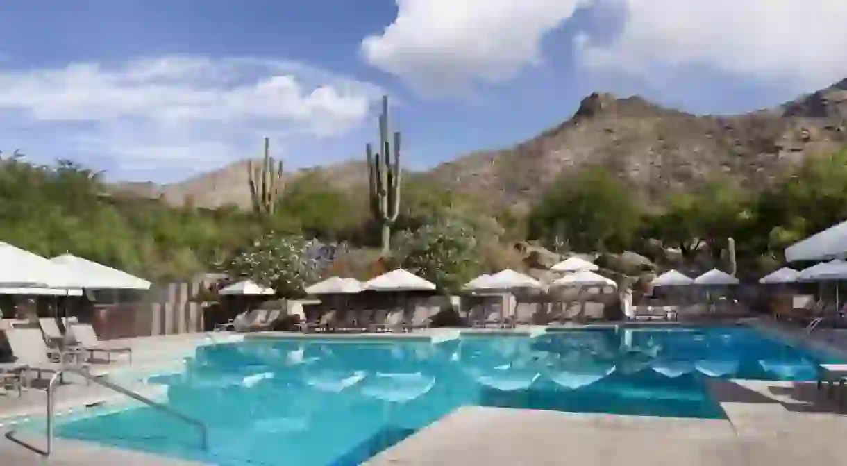 Soak up the mountain views from your lounge chair at Loews Ventana Canyon Resort in Tuscon