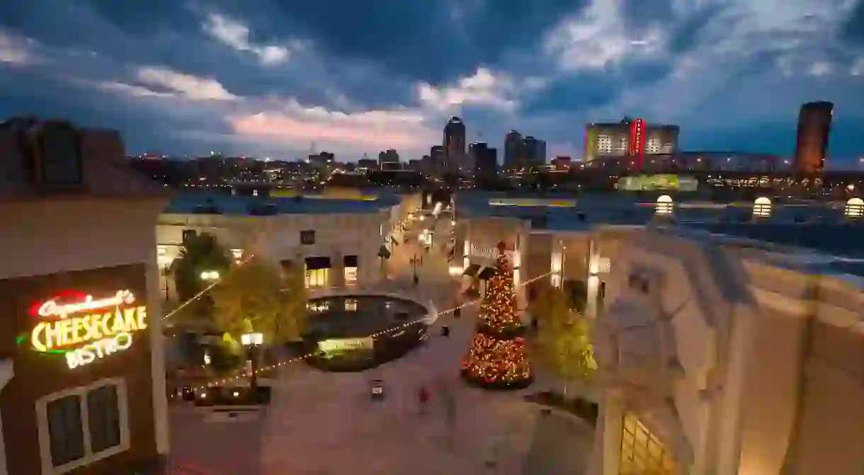 The Shreveport skyline rises behind the popular Louisiana Boardwalk Outlets in Bossier City