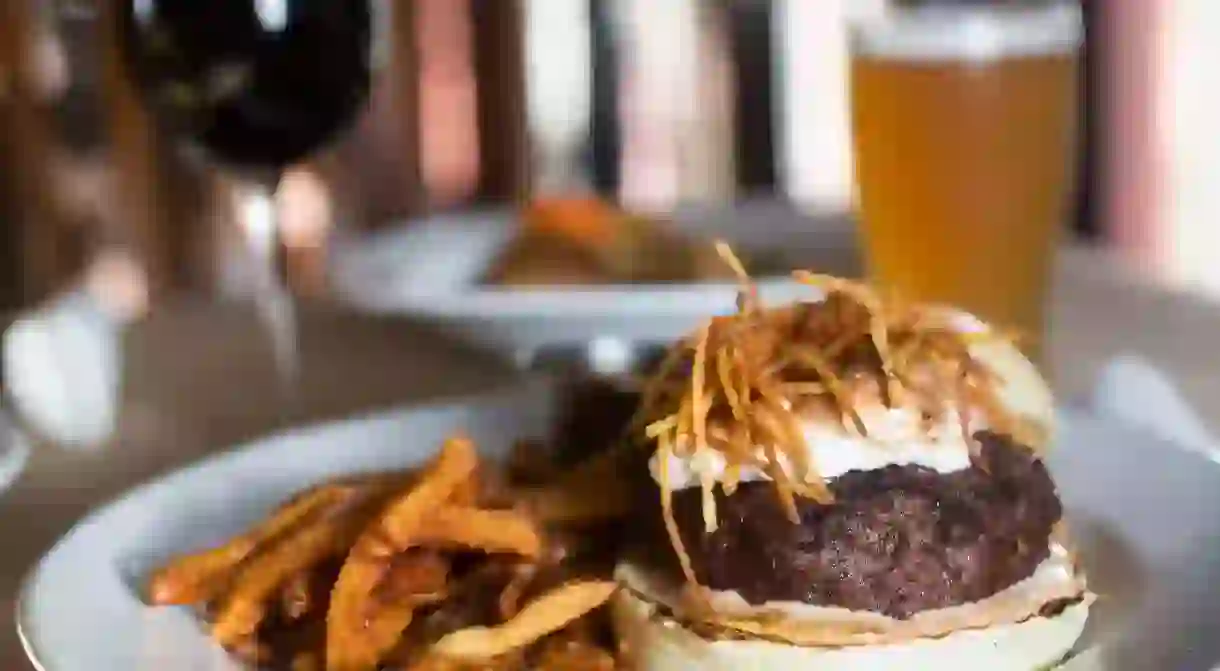 The Refined burger with peanut butter, marshmallow fluff, potato sticks and fancy sauce served with Yukon Gold fries at The Refinery in Tampa.