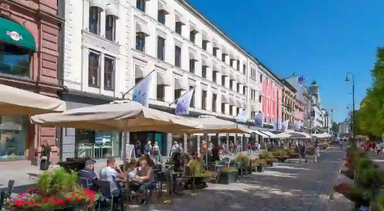 Cafes, bars, restaurants and shops on Karl Johans gate in the city centre, Oslo, Norway