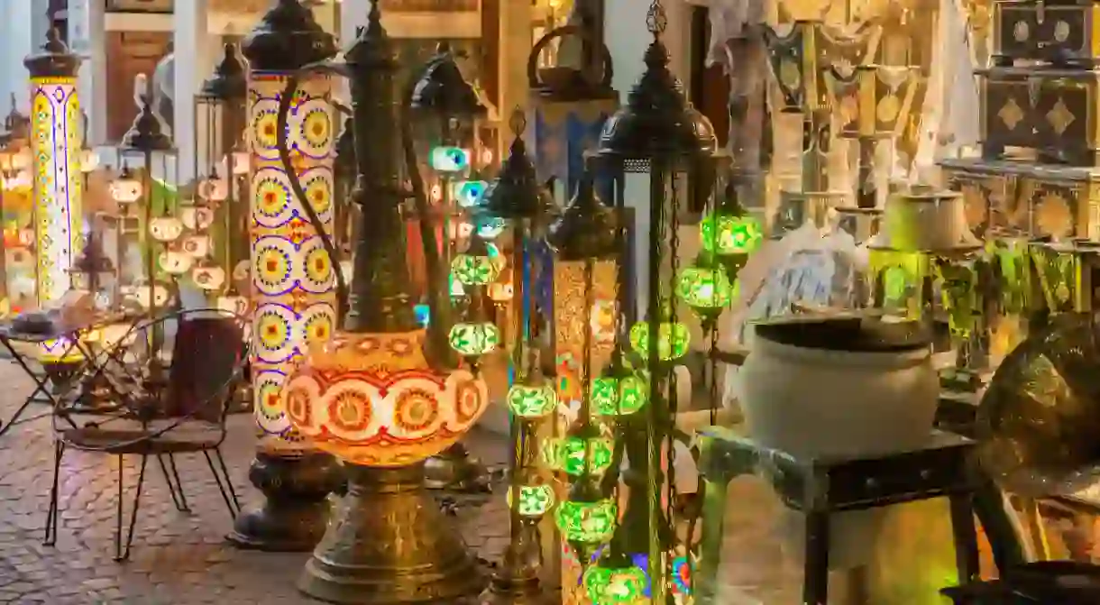 Browse intricately-detailed lanterns, handwoven fabrics and spices at the bustling Bab el-Bahrain Souq in Manama