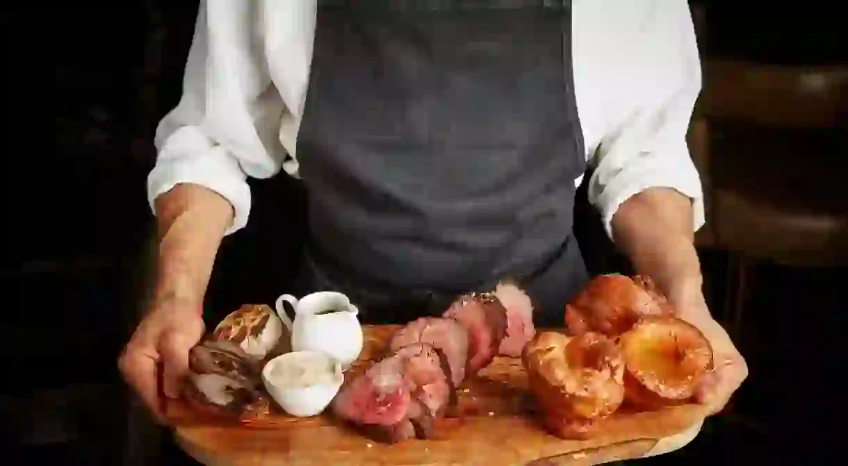 Delicious roast beef served on a wooden platter