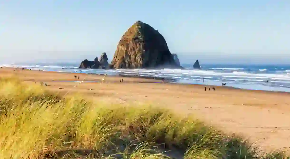 People walking on the beach near Haystack Rock on the Oregon coast