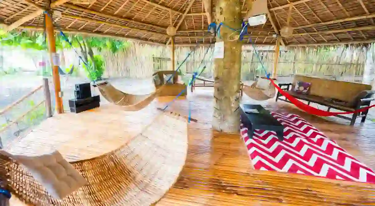 Spend lazy days in the shared hammocks at Bamboo Hostel Palawan