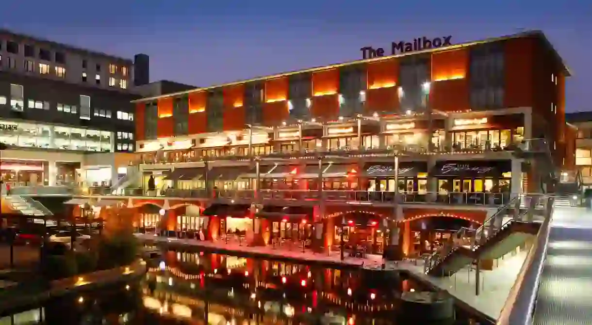 The Mailbox development at night, showing bars and restaurants along the canal. Birmingham, West Midlands, England, UK