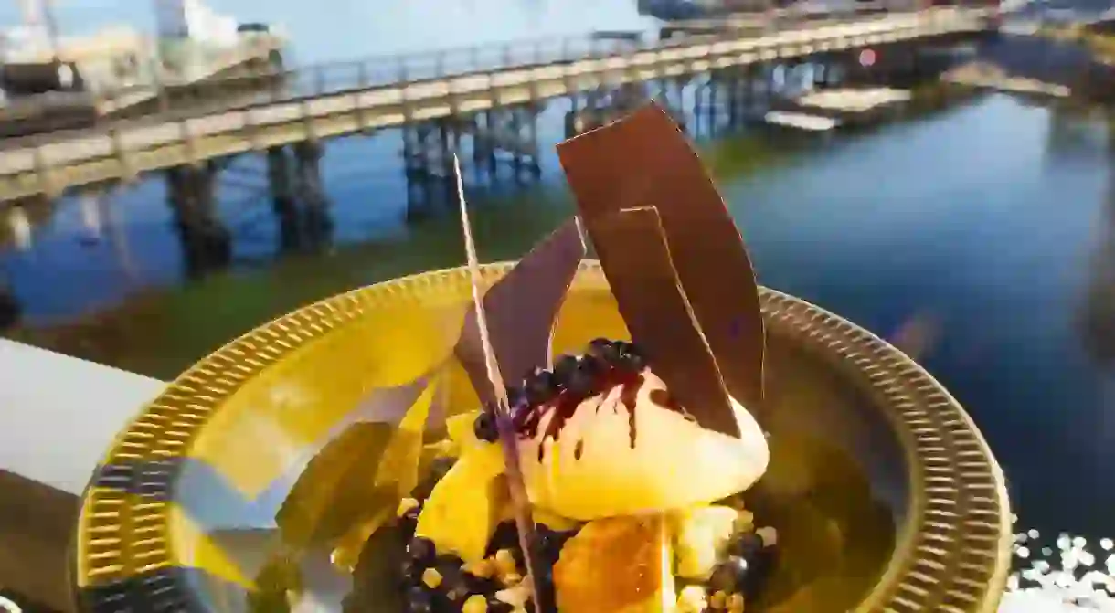 Ice cream of woodruff with cloudberries, sour cream, crunchy sourdough bread and chocolate crumbs, served at Oaxen Krog and Slip, one of Stockholms restaurants located on the tiny island of Beckholmen