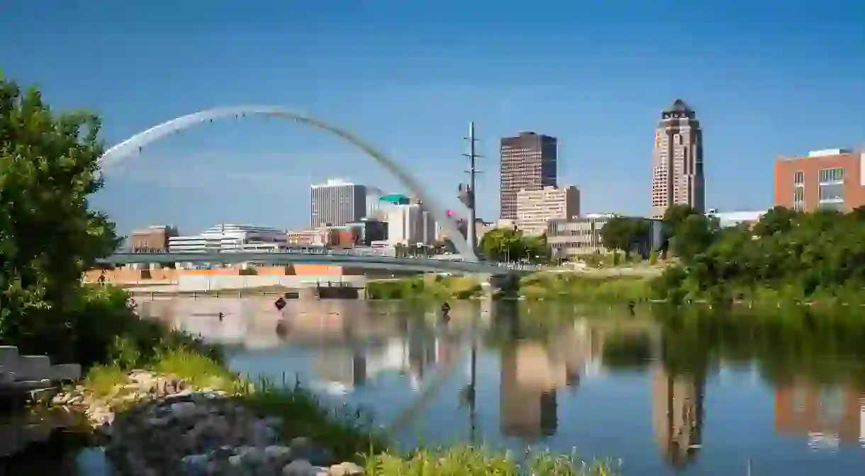 The Des Moines River and downtown pedestrian bridge in Des Moines, Iowa, USA