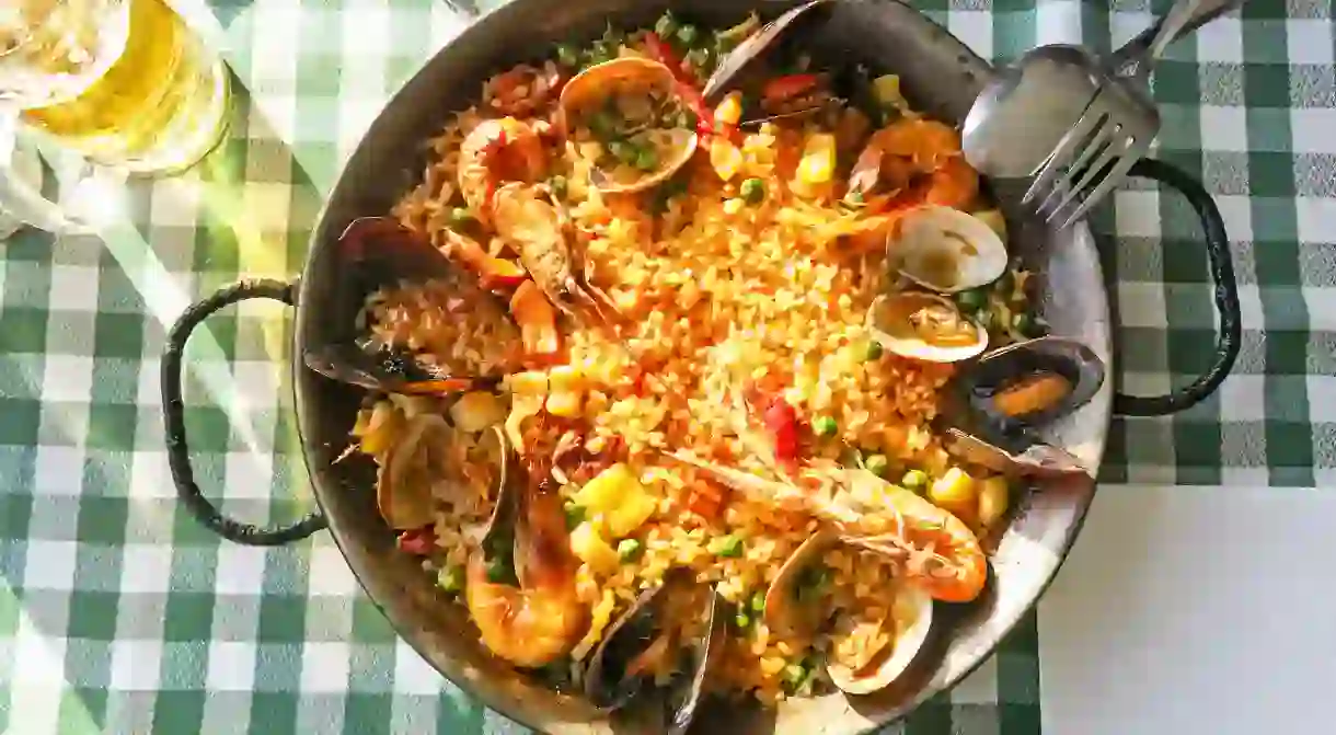 Typical spanish seafood paella in traditional pan, Barcelona